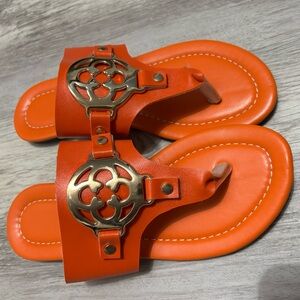 Vibrant Orange Sandals with Decorative Gold Accents